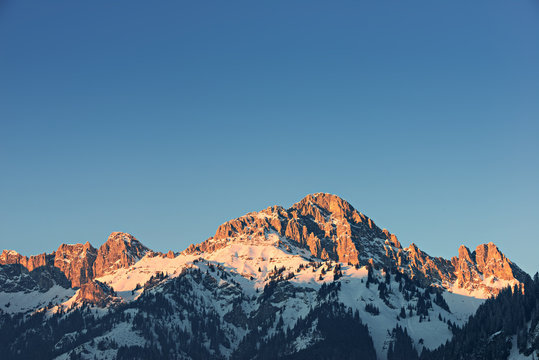 Glowing Orange Mountain Peak At Sunset In Tirol Alps