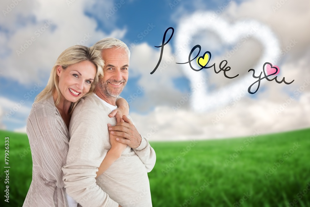 Poster Composite image of happy couple standing and hugging