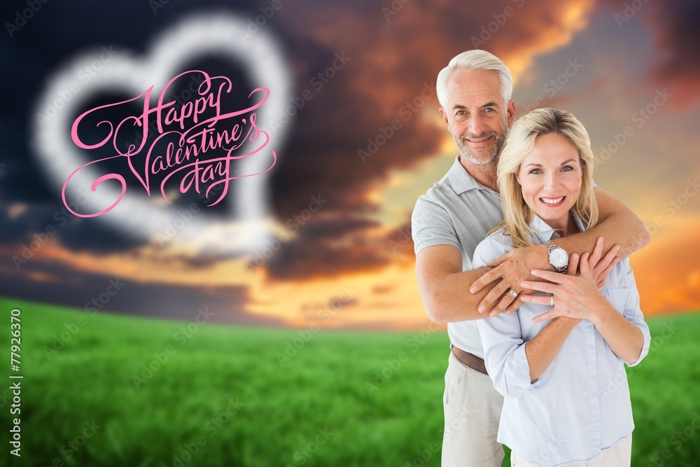 Aufkleber composite image of happy couple smiling at camera and embracing