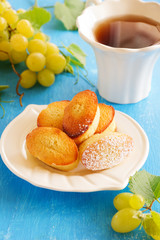 Madeleine cakes with grapes,