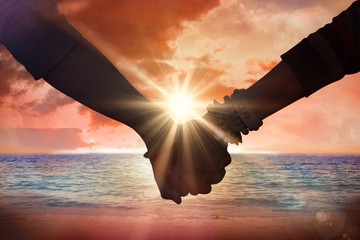 Composite image of students holding hands