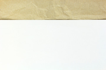Old crumpled paper and white sheet papper on top background