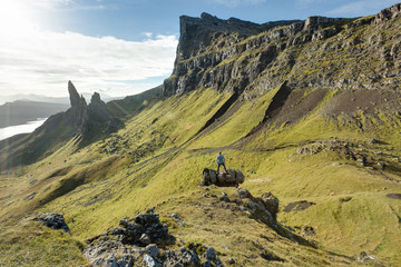 Man conquering Scottish highland landscape