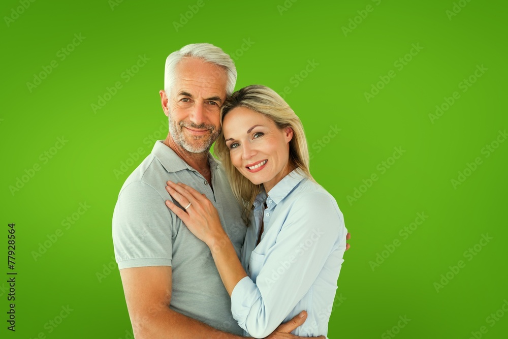 Poster Composite image of happy couple standing and smiling at camera