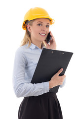 pretty business woman architect in builder helmet talking by pho