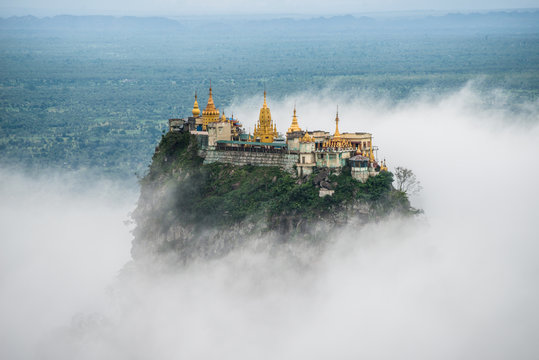 Mount Popa over the clouds in Bagan, Myanmar.