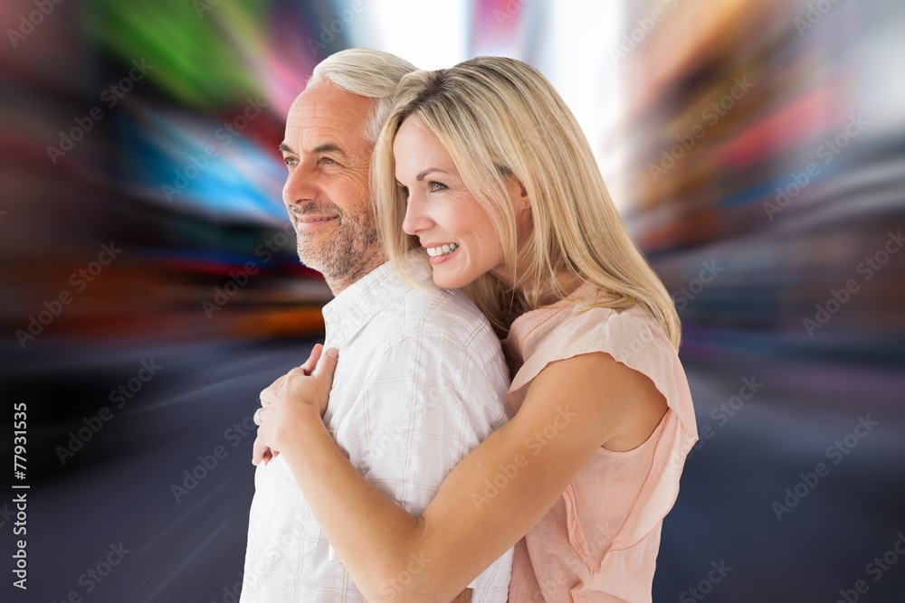 Aufkleber Composite image of affectionate couple standing and hugging
