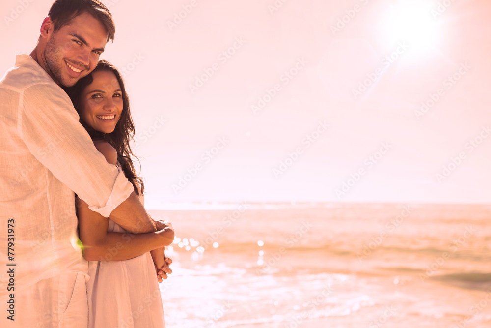 Poster smiling couple hugging and looking
