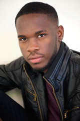 Handsome african american man posing in black leather jacket