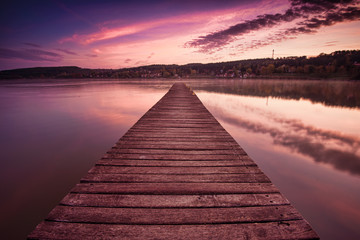 An empty pier, a beautiful lake