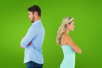 Composite image of unhappy couple not speaking to each other