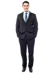 Confident businessman posing over white