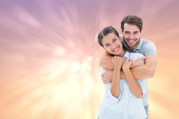 Composite image of cute couple smiling at camera