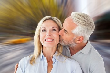 Affectionate man kissing his wife on the cheek