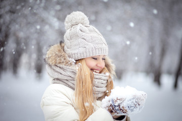 Girl holding snow