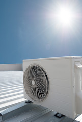 White air conditioning unit on a roof