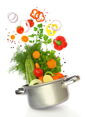 Fresh vegetables coming out of a cooking pot