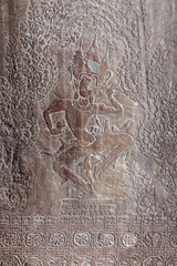 Carving of dancing Shiva on the wall of Angkor Wat