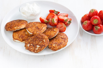 Pancakes with fresh strawberries and cream, horizontal