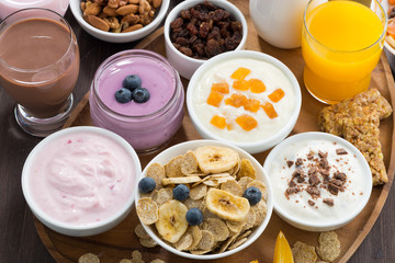 Obraz na płótnie Canvas rich breakfast buffet with cereals, yoghurt and fruit