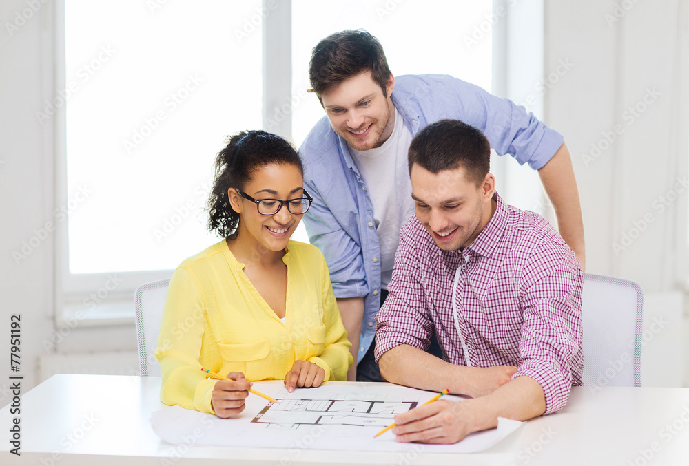 Canvas Prints three smiling architects working in office