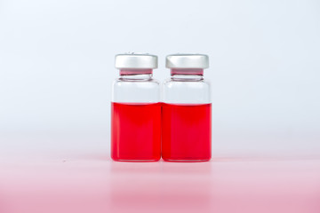Red liquid in injection vial and shadow effect