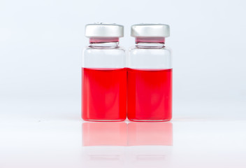 Red liquid in injection vial and shadow effect