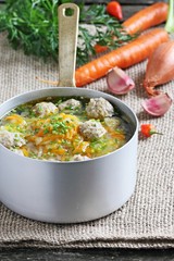 Soup with meatballs and vegetables.Selective focus