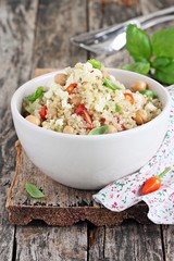 Quinoa salad with vegetables,chickpea and feta.Selective focus.