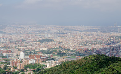 Fototapeta na wymiar Panorama on Barcelona city at hot summer day from Montjuic castl