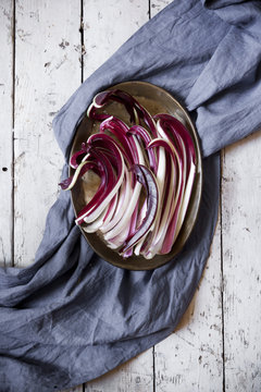 overhead shot of radicchio treviso quality on tray on table