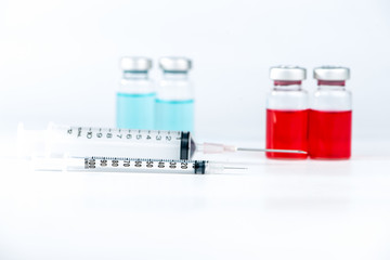 Disposable syringe and injection vials