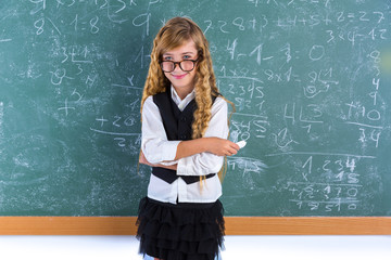 Nerd pupil blond girl in green board schoolgirl