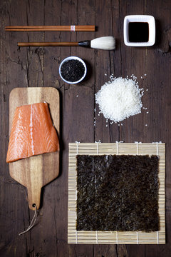 overhead shot of ingredients for sushi on wooden table