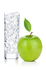 Glass of water with ice and fresh green apple