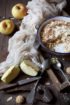 apple crumble with almonds on rustic table