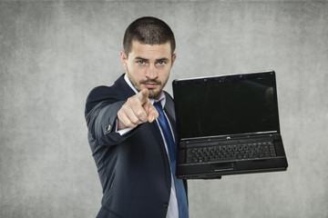 young businessman pointing at you