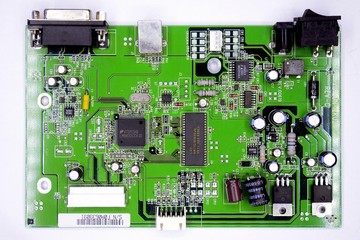 Fototapeta premium Green printed circuit board with radio parts
