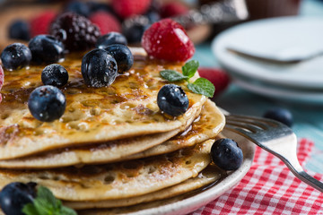 Delicious summer breakfast with fresh berries fruits and sirup
