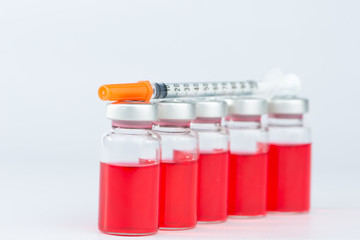 Disposable syringe on injection vials