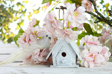 birdhouse and spring flowers