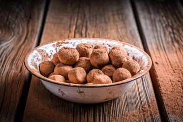 Sweet chocolate balls and cocoa powder