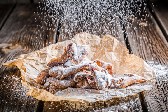 Powdered sugar falling on angel wings