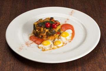 Spanish pisto or ratatouille  with quail eggs