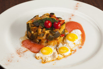 Spanish pisto or ratatouille  with quail eggs