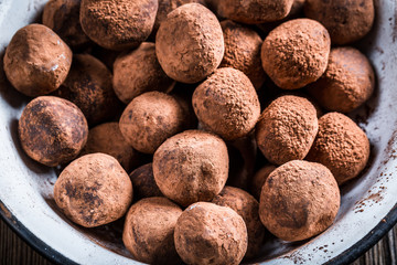 Closeup of chocolate balls in a white bowl