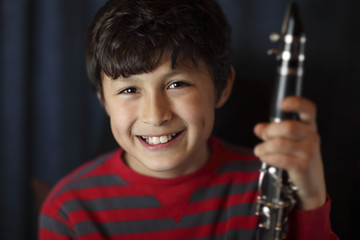 Smiling boy with clarinet