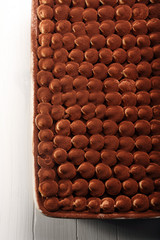 Dessert tiramisu cake on wooden background