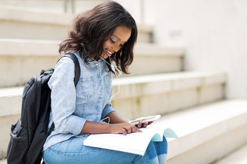 young afro american college girl reading