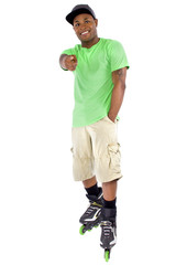 young adult black man balancing on rollerblade skates